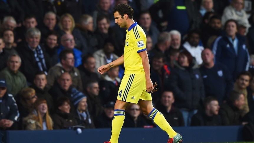 Early shower ... Cesc Fabregas leaves the pitch after being handed a red card