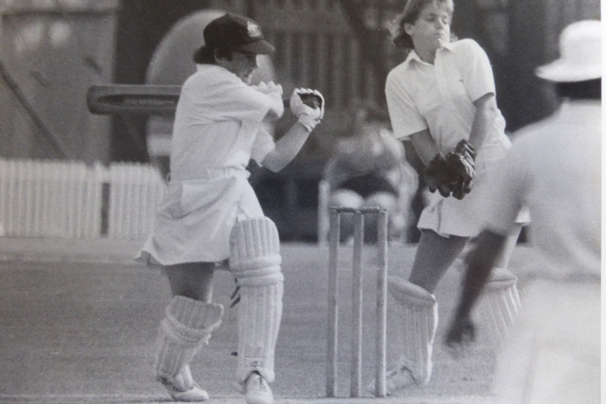 Denise Annetts plays a shot with the cricket bat.
