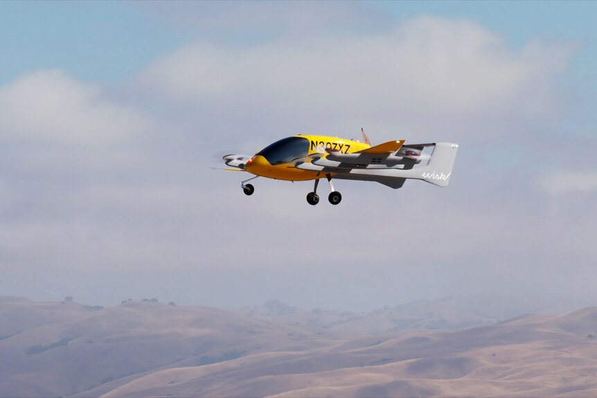 A small yellow air taxi in the sky. 