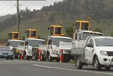 Civil contractors show off their new machinery in a convoy aimed at highlighting job losses on the NBN rollout.