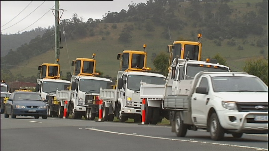 Civil contractors show off their new machinery in a convoy aimed at highlighting job losses on the NBN rollout.