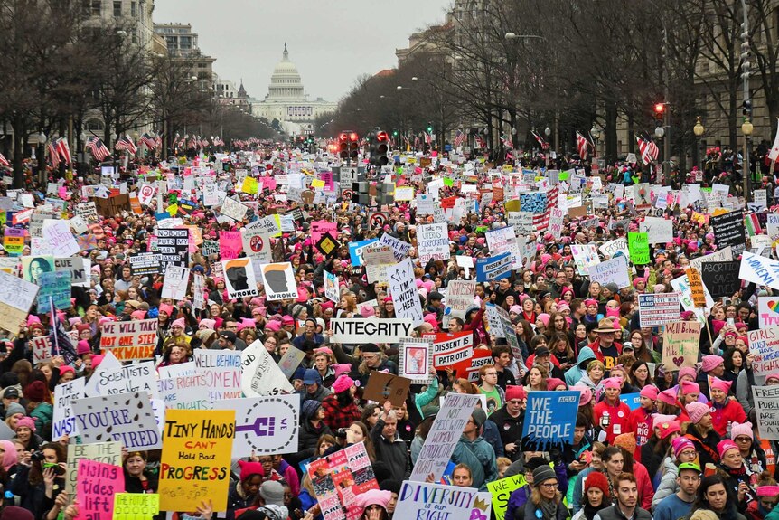 Hundreds of thousands march down Pennsylvania Avenue during the Women's March in Washington, DC on January 22, 2017.
