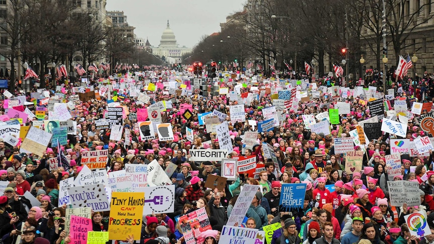 Hundreds of thousands march down Pennsylvania Avenue during the Women's March in Washington, DC on January 22, 2017.