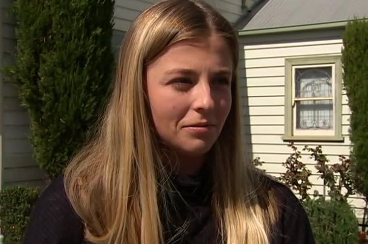 Sophie Savickas stands in the street.