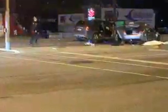 A screenshot from a Periscope video shows police at the scene of a two-car crash.