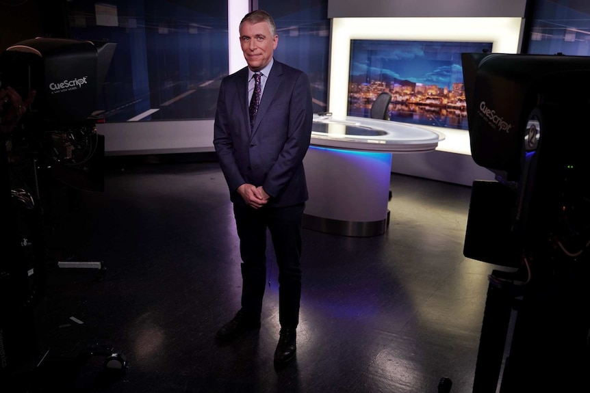 ABC Tasmania weather presenter Simon McCulloch on the news set.