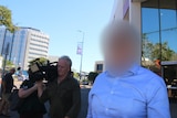 Blurred face image of a police officer.