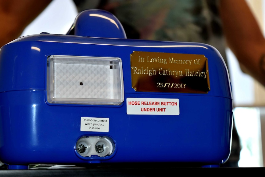 A cuddle cot with a plaque in memory of Raleigh Hateley.