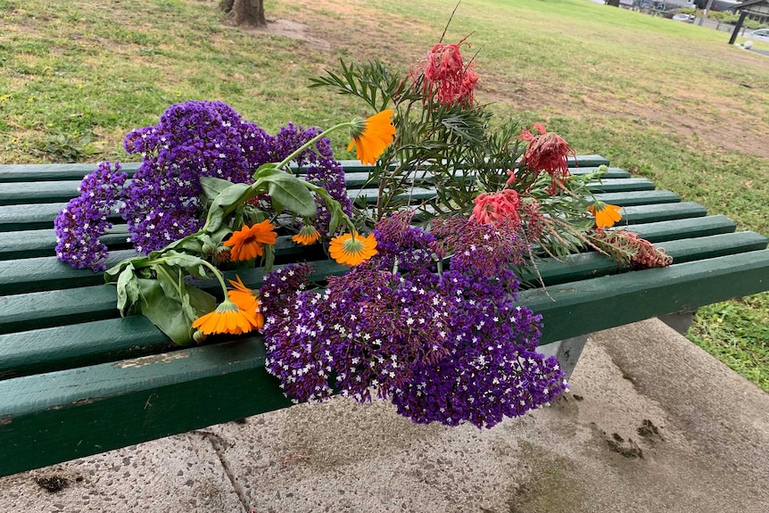 Flowers left on a bench in Mayer Park in Thornbury.