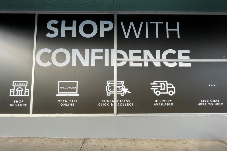 Large department wall signage promoting click and collect, online services 