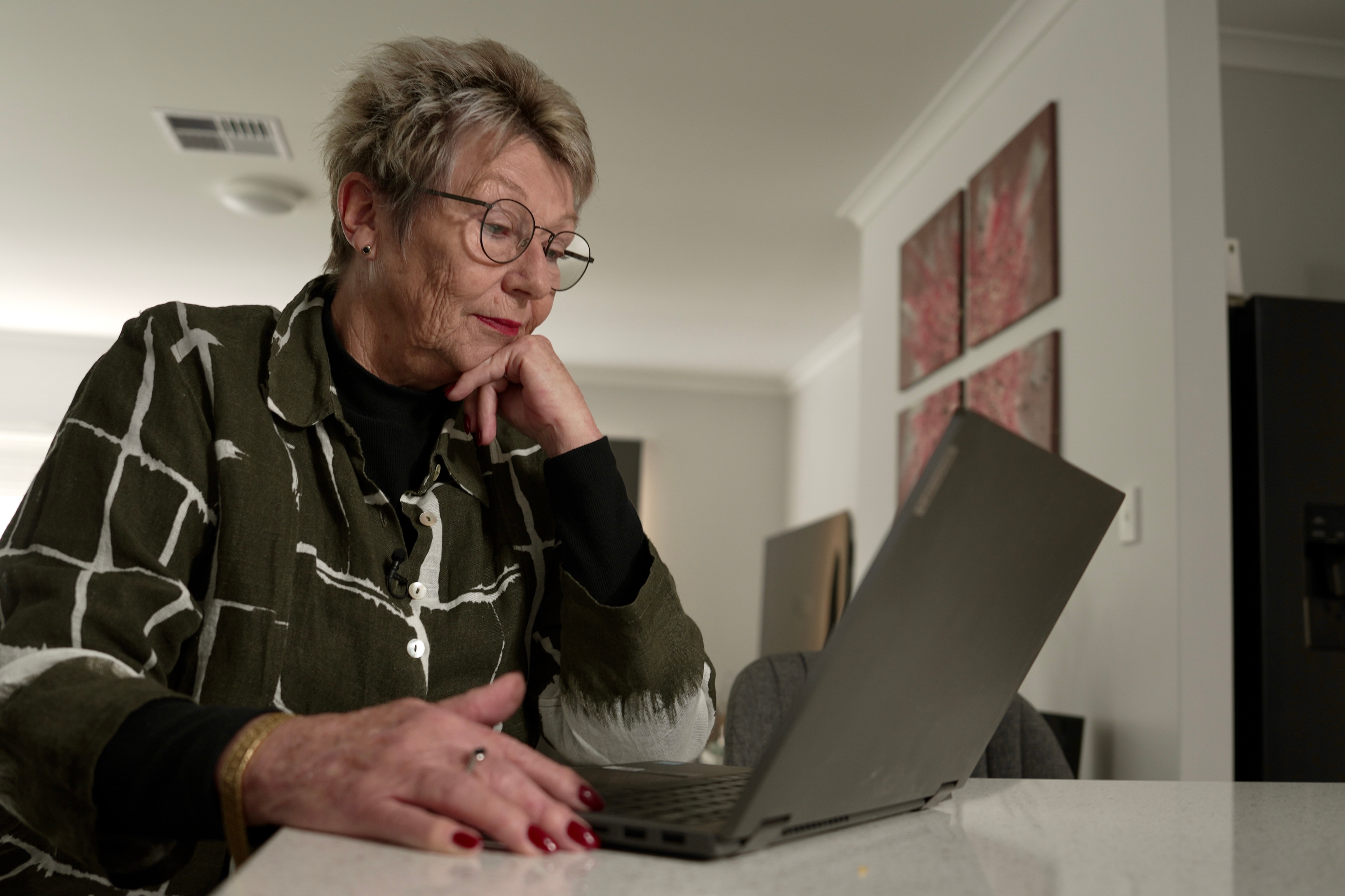 Jean Giles looks at her computer