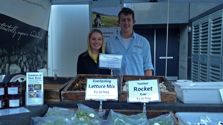 Glasgow packpackers Leeanne McKendry and Scott Bennett man the Near River Produce stall at the Port Macquarie markets.