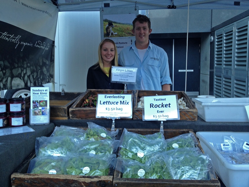 Glasgow backpackers Leeanne McKendry and Scott Bennett at the Near River Produce stall at the Port Macquarie markets.