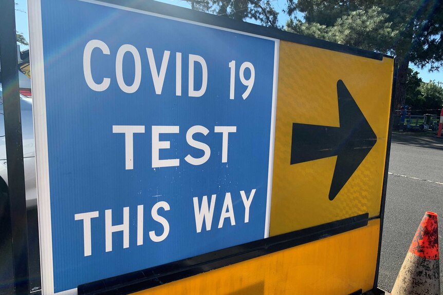 A sign pointing to a COVID-19 test site.
