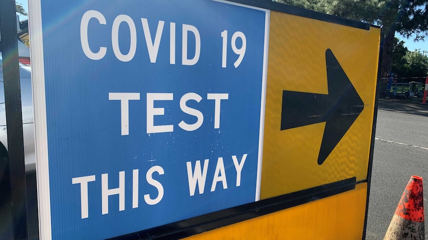 A sign pointing to a COVID-19 test site.