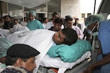 Pakistan hospital staff carry Sri Lankan cricket player Tharanga Paranavitana at a local hospital