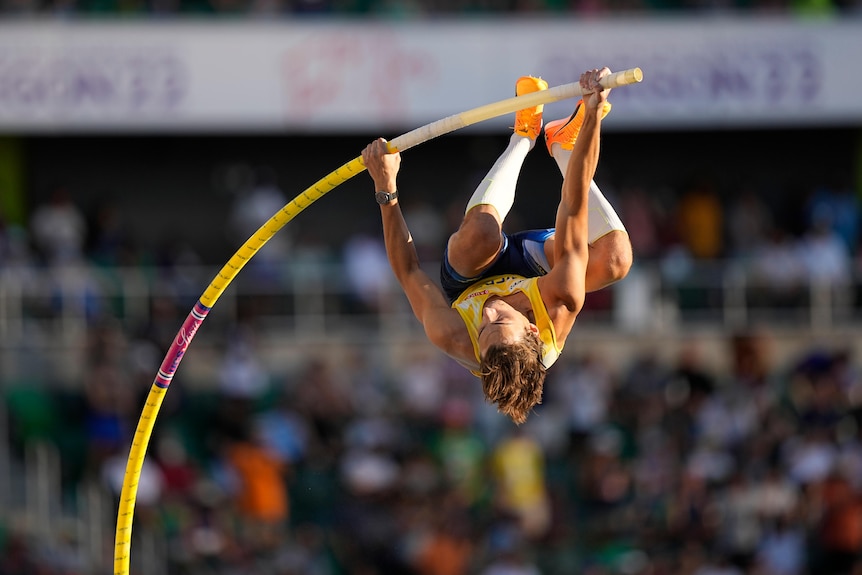 Armand Duplantis is upside down as he prepares to launch during the pole vault