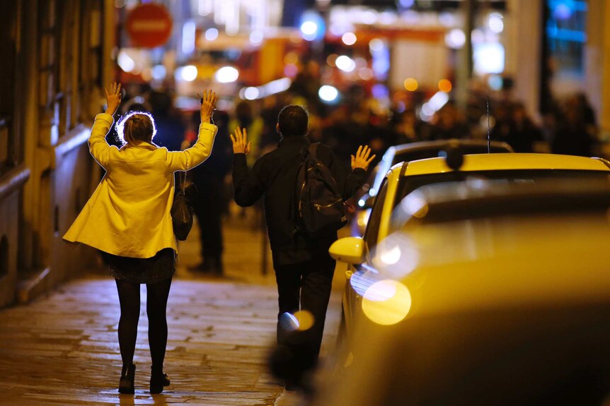Paris shooting - people on streets with their hands up to police