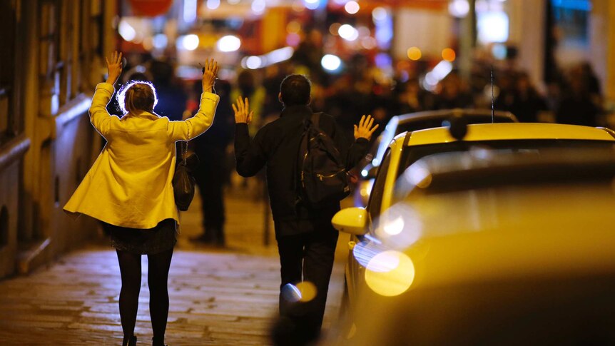 Paris shooting - people on streets with their hands up to police