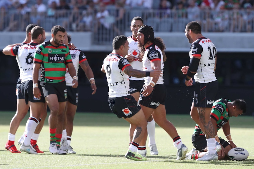 Isaiah Papali'i (R) of the Warriors is congratulated after his try against South Sydney in Perth.