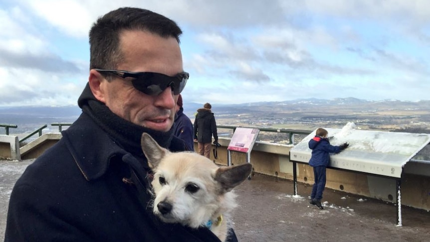 One small dog was not enjoying the chilly weather on top of Mount Ainslie.