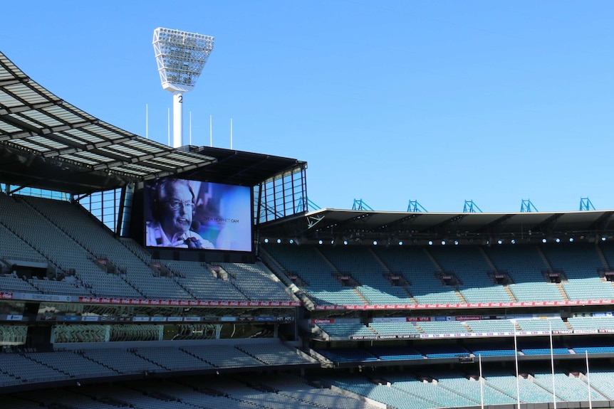 A photo of Drew Morphett on the big screen at the MCG.