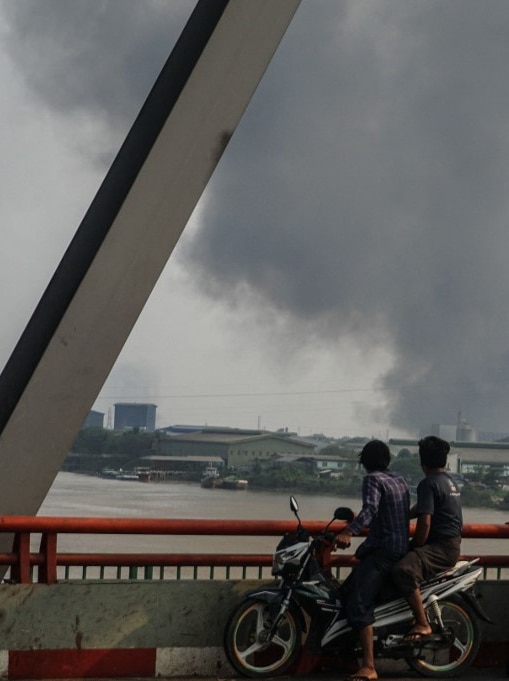Factories burn during protests in Yangon, Myanmar, March 2021