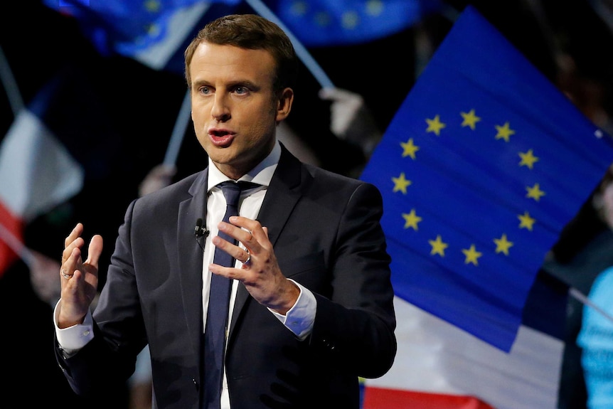 Emmanuel Macron attends a campaign rally.