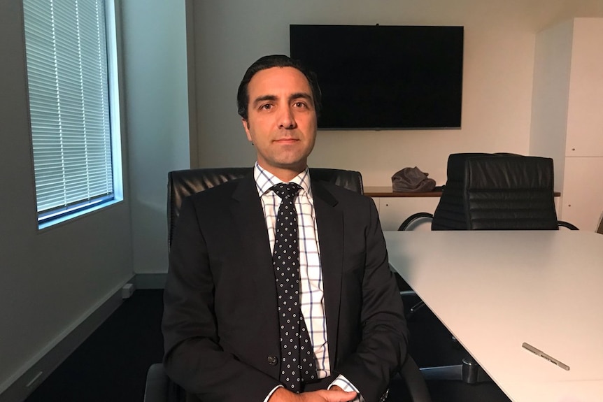 Lawyer Nick Mazzeo sits in his office.