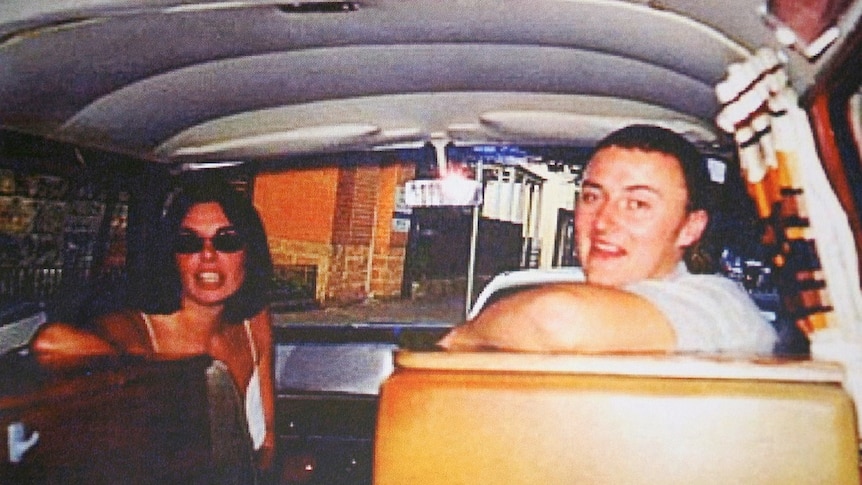A man and a woman inside a camper van.