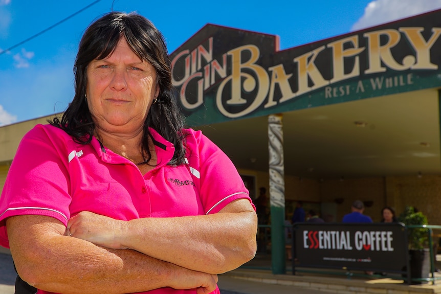 Gin Gin Bakery owner Maree Baker stands outside her shop with arms folded.