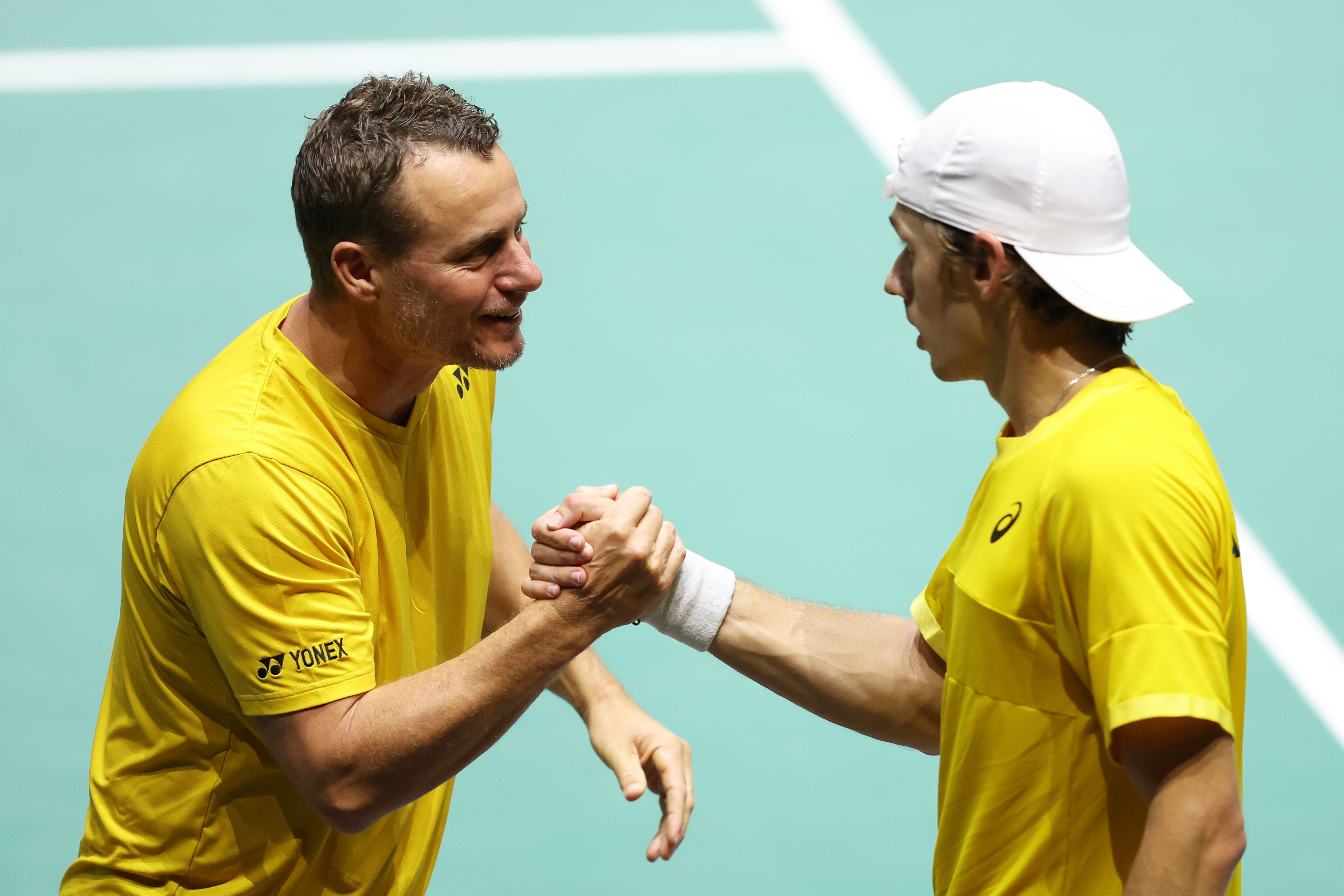Alex de Minaur shakes Lleyton Hewitt's hand