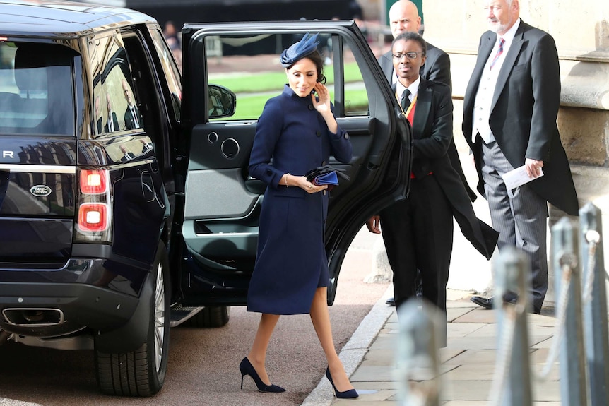 The Duchess of Sussex arrives for the wedding of Princess Eugenie to Jack Brooksbank at St George's Chapel.