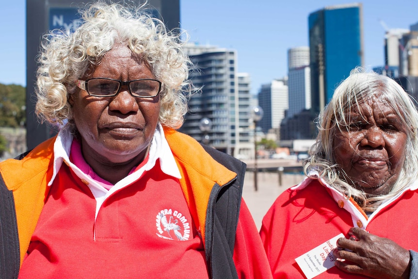 Yakanarra Elders Mary Vanbee and Jessie Moora stand in Circular Quay