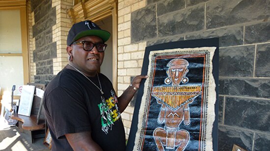 Artist Jimmy Nare from the Solomon Islands displays his art.