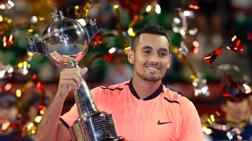 Nick Kyrgios with the trophy after winning Japan Open