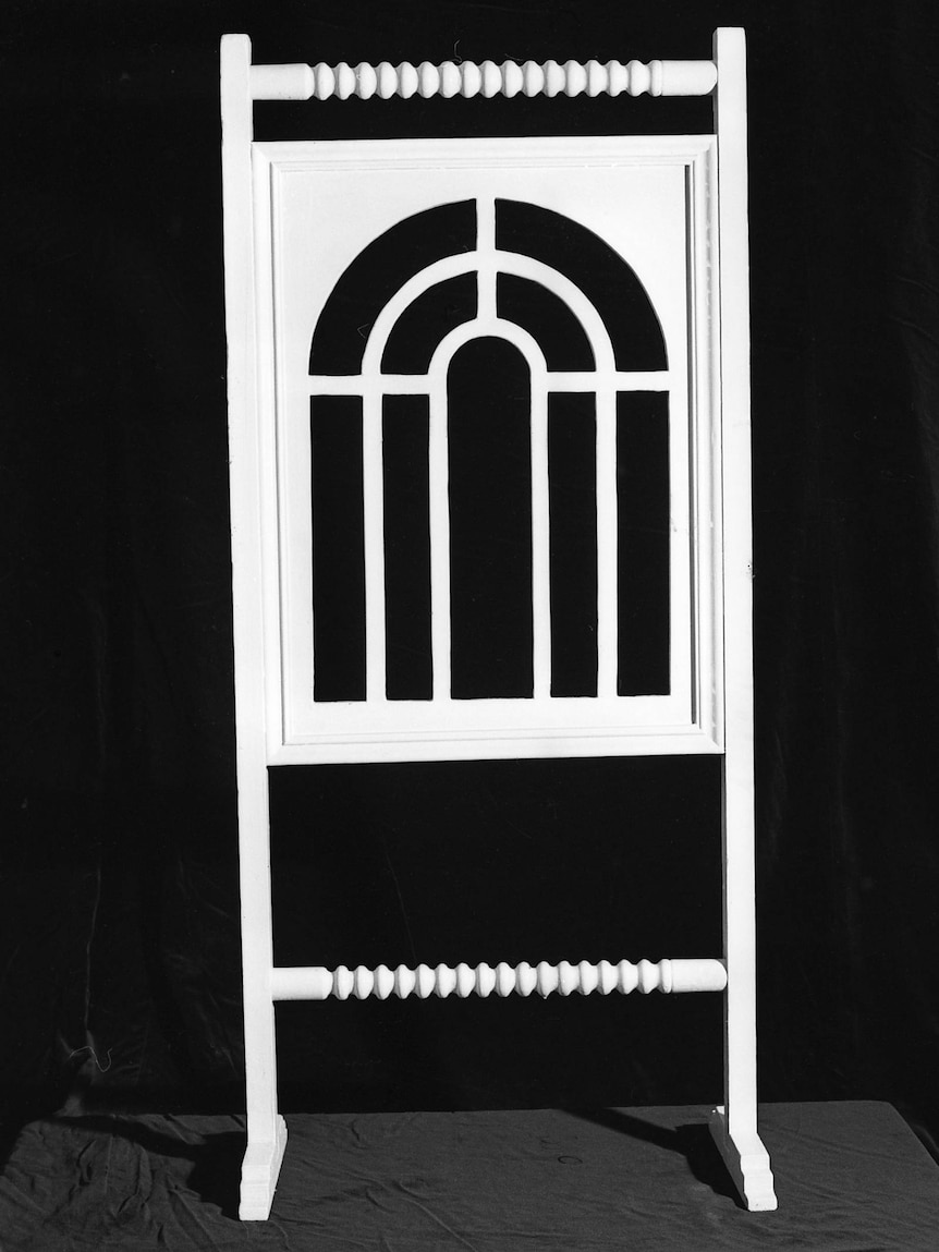 A white arched window displayed on a black background.