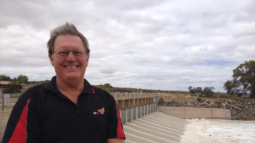 Menindee local Barry Stone watches water being released into Lake Menindee in October 2016.