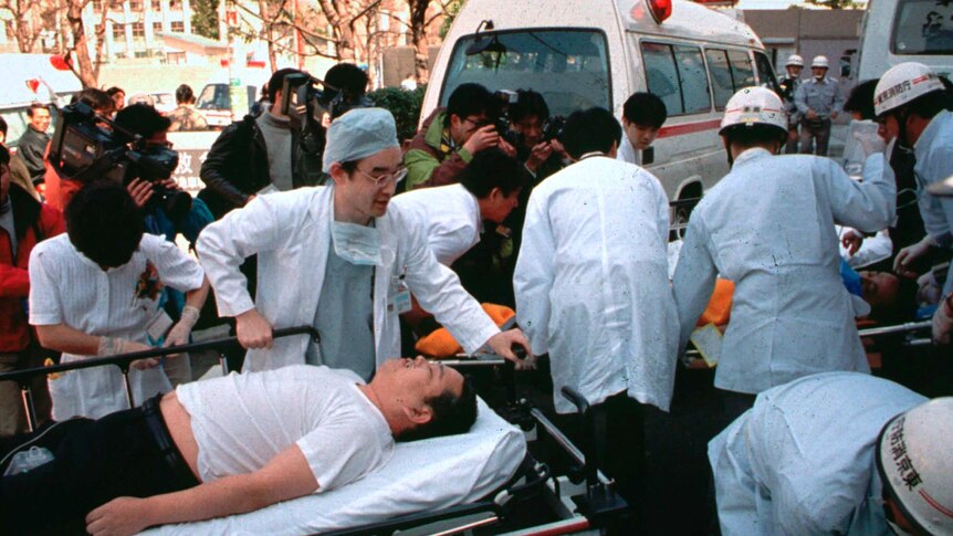 Passengers affected by sarin nerve gas in the central Tokyo subway trains are carried into St. Luke's International Hospital.