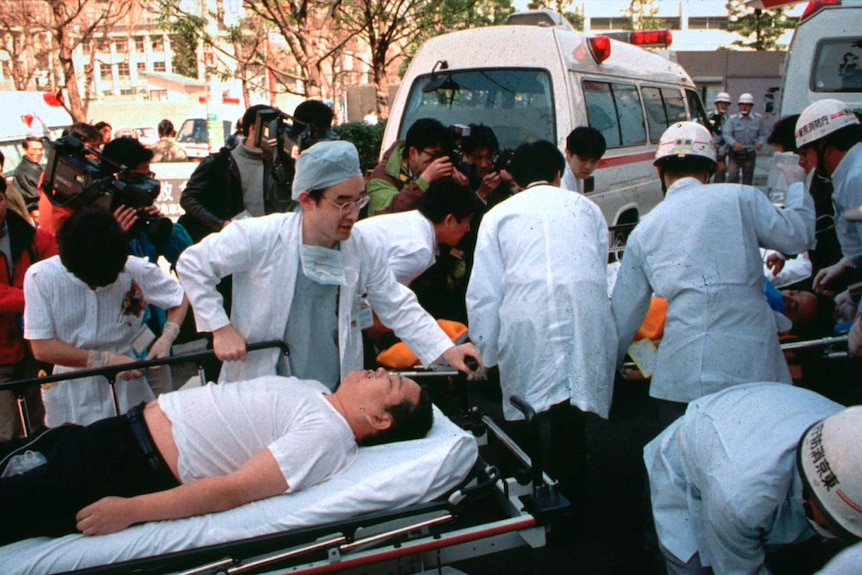 Passengers affected by sarin nerve gas in the central Tokyo subway trains are carried into St. Luke's International Hospital.