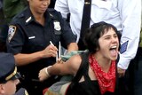 Police arrest a demonstrator affiliated with the Occupy Wall Street movement