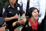 Police arrest a demonstrator affiliated with the Occupy Wall Street movement
