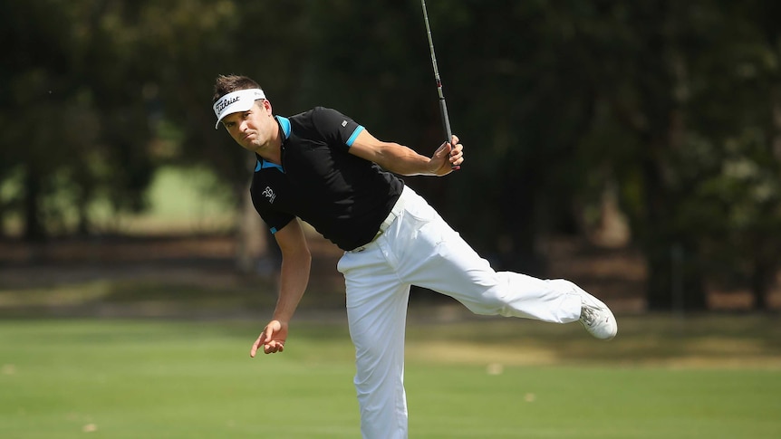 Paul Spargo examines a putt at the Australian Masters