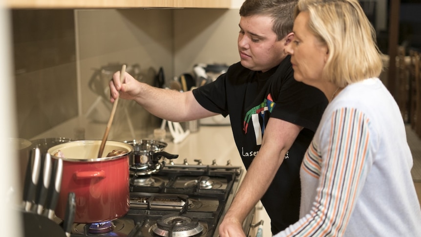 Tom Neale and his mother, Helen, cooking together in their kitchen