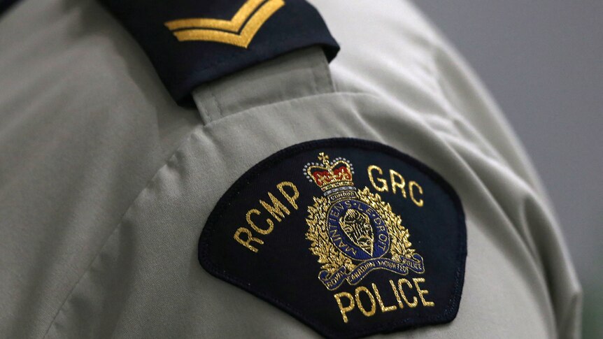 A Royal Canadian Mounted Police crest on a member's uniform.
