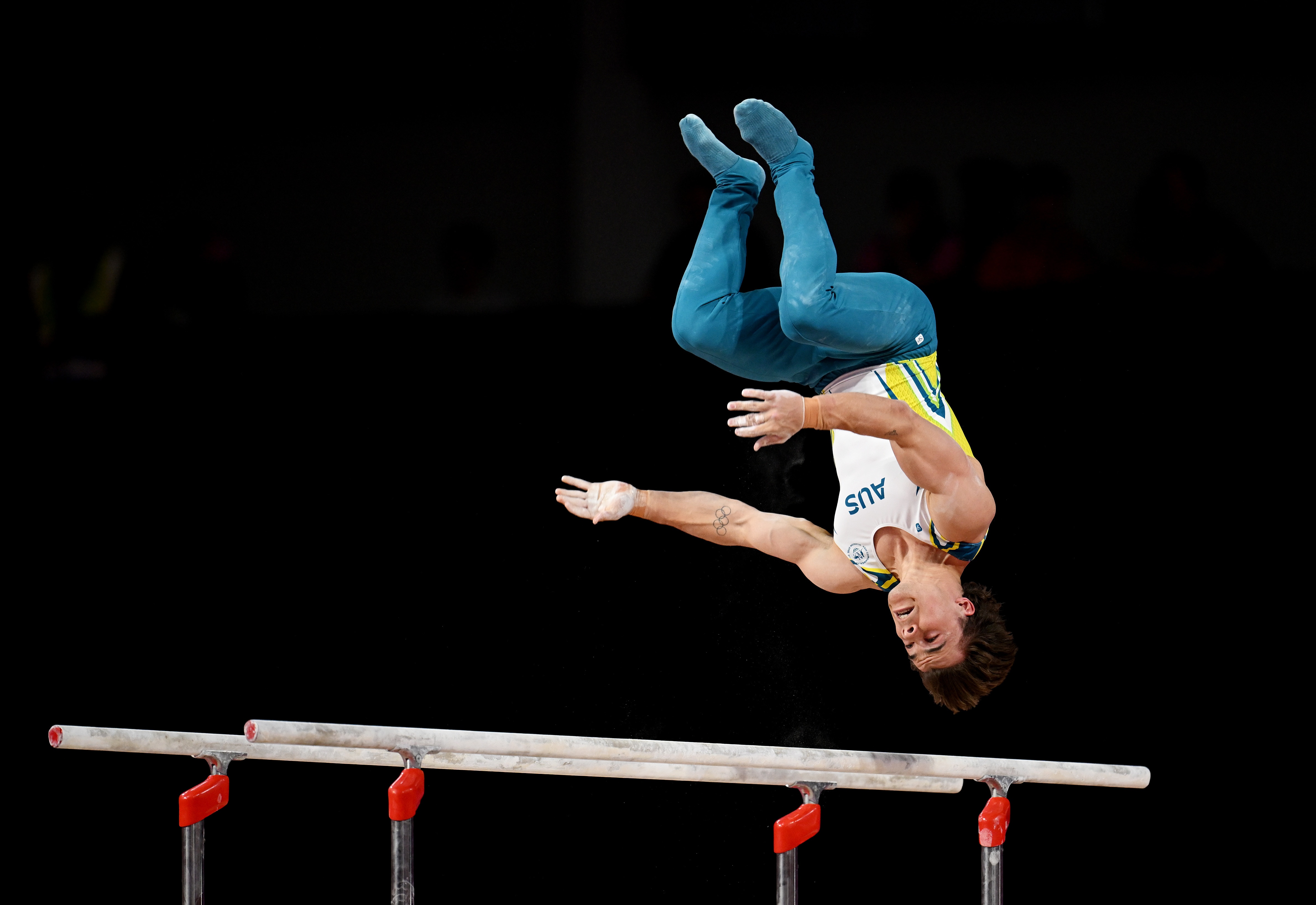 Jesse Moore flips off the bars.