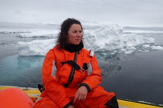 Amelie Meyer in a boat among sea ice