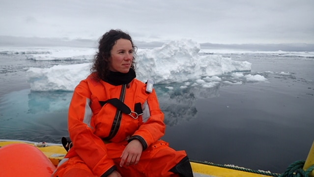 Amelie Meyer in a boat among sea ice