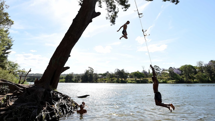 Local kids cool off in the Nepean River during a Sydney heatwave