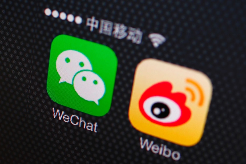 A shot of a phone screen showing WeChat and Weibo apps